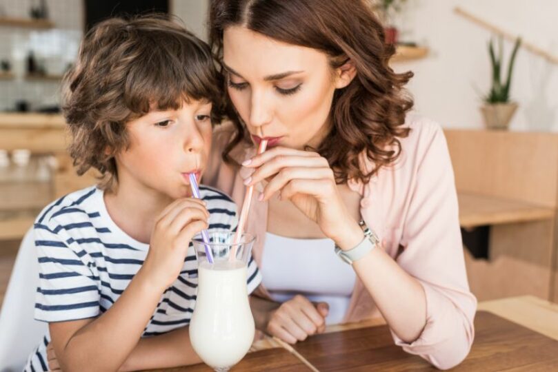 mom and son drinking milkshake